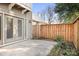 Private patio with french doors and wood fence at 3706 Selwyn Farms Ln # 17-3, Charlotte, NC 28209