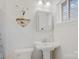 Clean bathroom with pedestal sink and marble shower at 663 14Th Nw Ave, Hickory, NC 28601