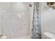 Modern bathroom with a marble shower and floral curtain at 663 14Th Nw Ave, Hickory, NC 28601