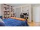 Bedroom with a double bed, built-in shelves, and a workspace at 663 14Th Nw Ave, Hickory, NC 28601