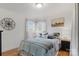 Cozy bedroom with light blue bedding and wood floors at 663 14Th Nw Ave, Hickory, NC 28601