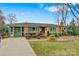 Ranch home with green door and landscaped yard at 663 14Th Nw Ave, Hickory, NC 28601