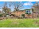 Brick house back view, showcasing a sunroom and garden at 663 14Th Nw Ave, Hickory, NC 28601