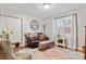 Living area featuring a brown leather couch and clock at 663 14Th Nw Ave, Hickory, NC 28601