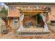 Cozy backyard patio with pergola, seating, and brick wall at 663 14Th Nw Ave, Hickory, NC 28601