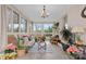 Bright sunroom with wicker furniture and large windows at 663 14Th Nw Ave, Hickory, NC 28601