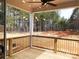 View from covered back porch and ceiling fan to wooded lot on sunny day at 143 Dabbling Duck Cir, Mooresville, NC 28117