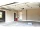 Spacious garage with neutral walls and white trim with plenty of storage space at 143 Dabbling Duck Cir, Mooresville, NC 28117