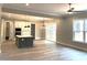 Bright open floorplan with a kitchen island, sliding glass doors, and modern finishes throughout the living area at 143 Dabbling Duck Cir, Mooresville, NC 28117