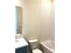 Clean-lined bathroom featuring a tub-shower and vanity with solid-surface countertops at 148 Dabbling Duck Cir, Mooresville, NC 28117