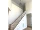 Bright foyer with white trim, hardwood stairs, modern light fixture, and transom window at 148 Dabbling Duck Cir, Mooresville, NC 28117