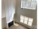 Bright living room with fireplace and large windows, offering scenic views at 148 Dabbling Duck Cir, Mooresville, NC 28117