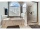 Large soaking tub and walk-in shower with natural light at 2315 Smith Harbour Dr, Denver, NC 28037