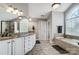 A large bathroom with dual sinks, a soaking tub, and a walk-in shower at 2315 Smith Harbour Dr, Denver, NC 28037