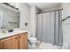 Bathroom featuring a wood vanity with a shower and tub combination at 2315 Smith Harbour Dr, Denver, NC 28037