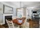 Dining room with a fireplace, decorative lighting fixture, and hardwood floors at 2315 Smith Harbour Dr, Denver, NC 28037
