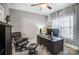 Comfortable home office includes a large desk, comfortable seating, and natural light at 2315 Smith Harbour Dr, Denver, NC 28037