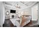 Comfortable living room with fireplace, coffered ceilings, recessed lighting, and hardwood floors at 2315 Smith Harbour Dr, Denver, NC 28037