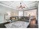 Spacious living room featuring coffered ceiling, large windows, hardwood floors and an area rug at 2315 Smith Harbour Dr, Denver, NC 28037