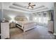 Spacious main bedroom features a tray ceiling, an area rug, and ensuite bathroom access at 2315 Smith Harbour Dr, Denver, NC 28037