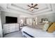 Spacious main bedroom with tray ceilings, sitting area, and ample natural light at 2315 Smith Harbour Dr, Denver, NC 28037