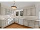 Kitchen boasts light cabinets, hardwood floors, and a window at 243 Ridgewood Ave, Charlotte, NC 28209