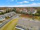 Community view showcasing homes, landscaping, and a quiet street at 2471 Palmdale Walk Dr # 107, Fort Mill, SC 29708