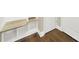 Built-in corner shelving and hardwood floors in the basement at 2471 Palmdale Walk Dr # 107, Fort Mill, SC 29708