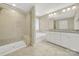Large bathroom with double vanity and a soaking tub at 2471 Palmdale Walk Dr # 107, Fort Mill, SC 29708
