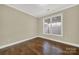 Spacious bedroom with hardwood floors and large window at 2471 Palmdale Walk Dr # 107, Fort Mill, SC 29708