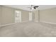 Simple bedroom with plush carpet and access to bathroom at 2471 Palmdale Walk Dr # 107, Fort Mill, SC 29708