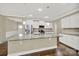 Spacious kitchen with granite island, stainless steel appliances, and hardwood floors at 2471 Palmdale Walk Dr # 107, Fort Mill, SC 29708