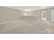 Spacious loft area with carpet and access to other rooms at 2471 Palmdale Walk Dr # 107, Fort Mill, SC 29708