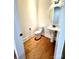 Powder room with pedestal sink, toilet, and wood-look flooring at 2971 Alveston Nw Dr # 29, Concord, NC 28027