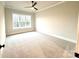 Bright bedroom with large windows, carpet flooring, and ceiling fan at 2971 Alveston Nw Dr # 29, Concord, NC 28027