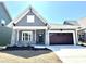 Charming single-Gathering home featuring stone accents, a two-car garage, and manicured landscaping at 2971 Alveston Nw Dr # 29, Concord, NC 28027