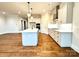 Modern kitchen with white cabinets, island, and stainless steel appliances at 2971 Alveston Nw Dr # 29, Concord, NC 28027