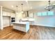 Modern kitchen with white cabinets, quartz countertops, and island at 2971 Alveston Nw Dr # 29, Concord, NC 28027