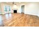 Living room with hardwood floors, fireplace, and access to patio at 2971 Alveston Nw Dr # 29, Concord, NC 28027