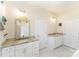 Primary bathroom boasts double vanities, a large soaking tub, and separate shower at 10221 Hanging Moss Trl, Charlotte, NC 28227