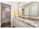 Double vanity bathroom with granite countertops at 10221 Hanging Moss Trl, Charlotte, NC 28227