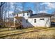 Back of house showing deck, and landscaping at 10221 Hanging Moss Trl, Charlotte, NC 28227