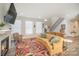 Living room with fireplace, large windows, and colorful rug at 10221 Hanging Moss Trl, Charlotte, NC 28227