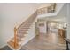 Wooden staircase with metal railing leading to upper level at 10221 Hanging Moss Trl, Mint Hill, NC 28227