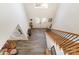 Grand foyer with a staircase, wooden railings, and ample natural light from skylight at 10221 Hanging Moss Trl, Mint Hill, NC 28227