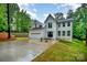 Lovely two-story home with a garage, a long driveway, and well-manicured front yard at 10221 Hanging Moss Trl, Mint Hill, NC 28227