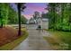 Charming two-story home featuring a modern design, two-car garage, and a long driveway at 10221 Hanging Moss Trl, Mint Hill, NC 28227