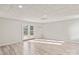 Open basement space with modern flooring, recessed lighting, and exterior access via French doors at 2505 Ashford Dr, Newton, NC 28658