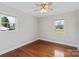 This bedroom offers two windows that brings in natural light and hardwood floors at 2505 Ashford Dr, Newton, NC 28658