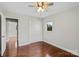 This bedroom offers hardwood floors, a closet and a window at 2505 Ashford Dr, Newton, NC 28658